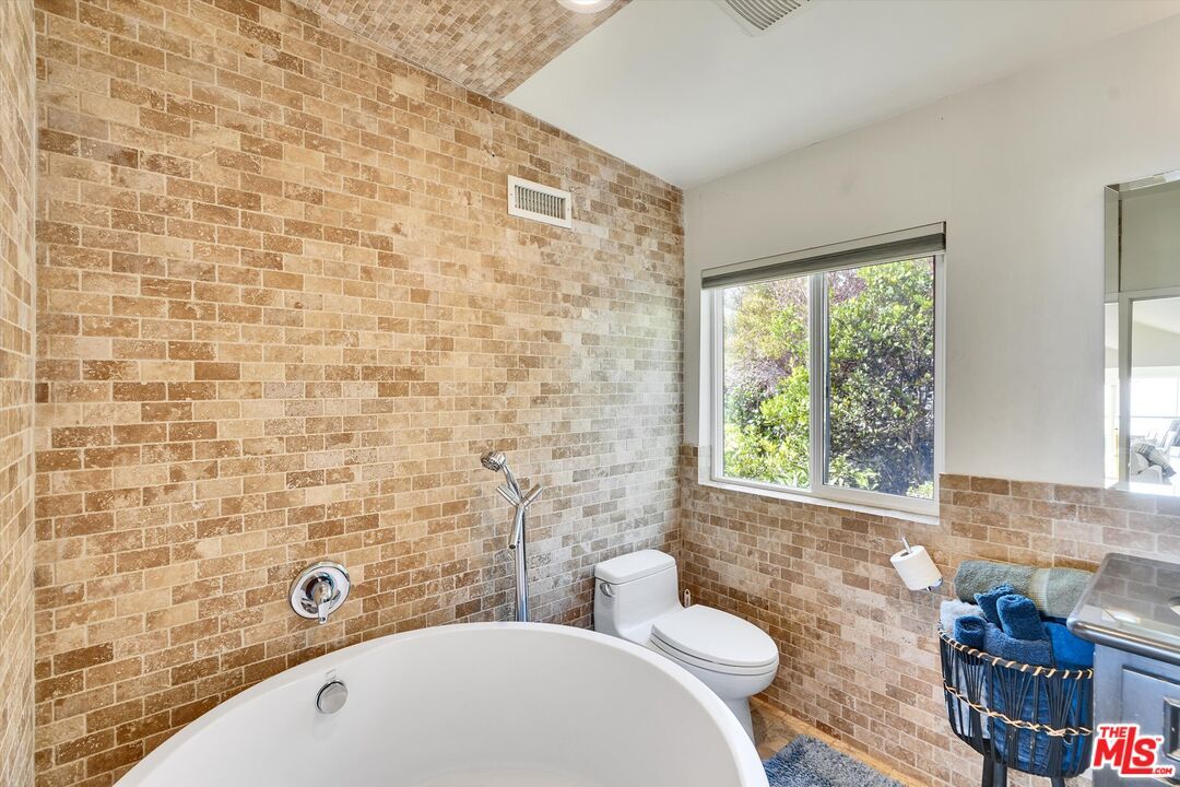 Bathroom, Free Standing Baths, Interior, Recessed Lighting, Stone Walls