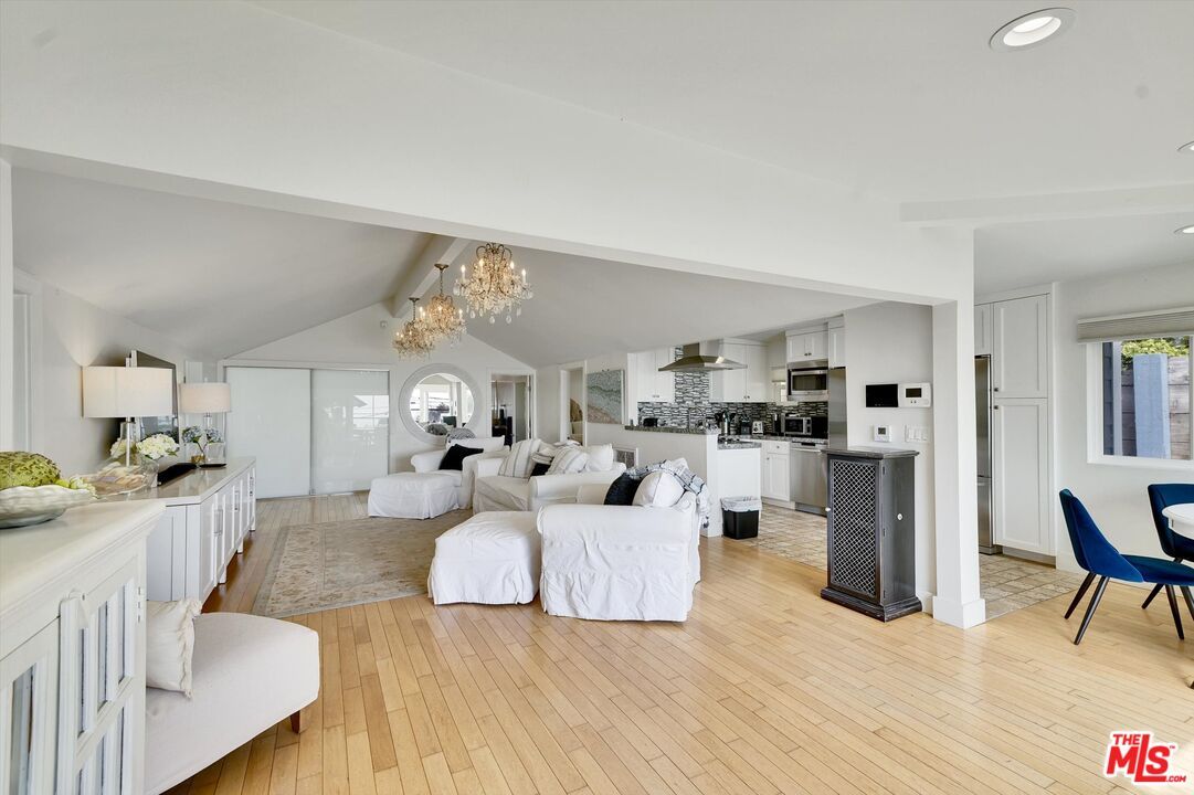 Chandelier, Interior, Kitchen, Living room, Recessed Lighting, Stainless Steel Appliances, Wood Texture Flooring