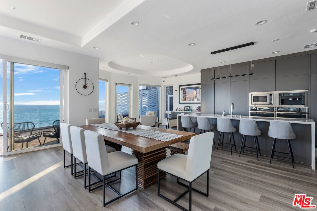 Dining room, Interior, Kitchen, Pendant Lights, Recessed Lighting, Stainless Steel Appliances, Water, Wood Texture Flooring