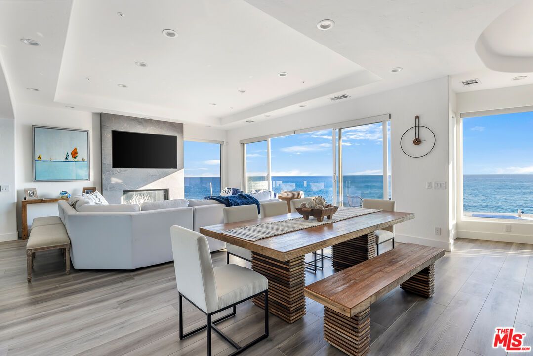 Dining room, Fireplace, Interior, Living room, Recessed Lighting, Water, Wood Texture Flooring