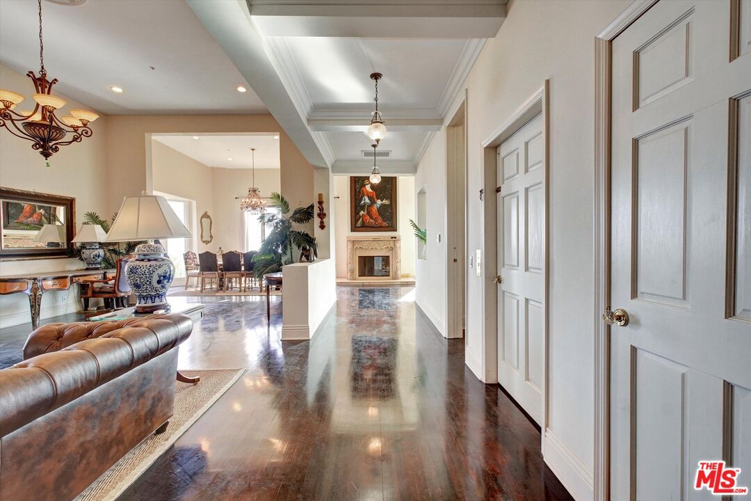 Chandelier, Dining room, Fireplace, Interior, Living room, Pendant Lights, Recessed Lighting, Wood Texture Flooring