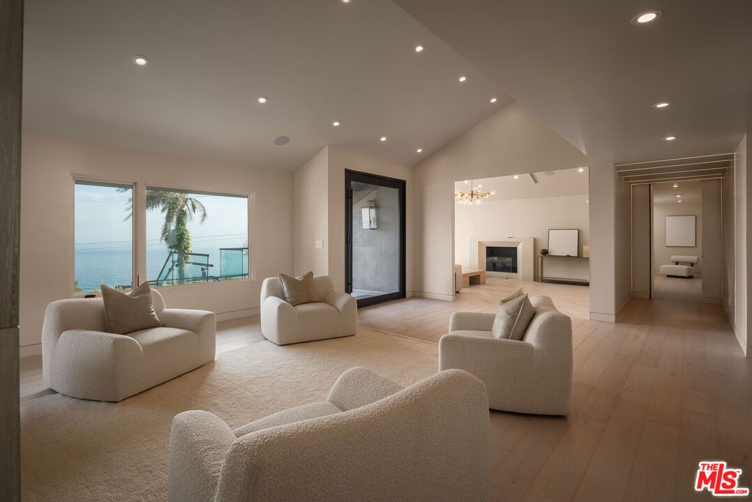 Fireplace, Interior, Living room, Recessed Lighting, Water, Wood Texture Flooring