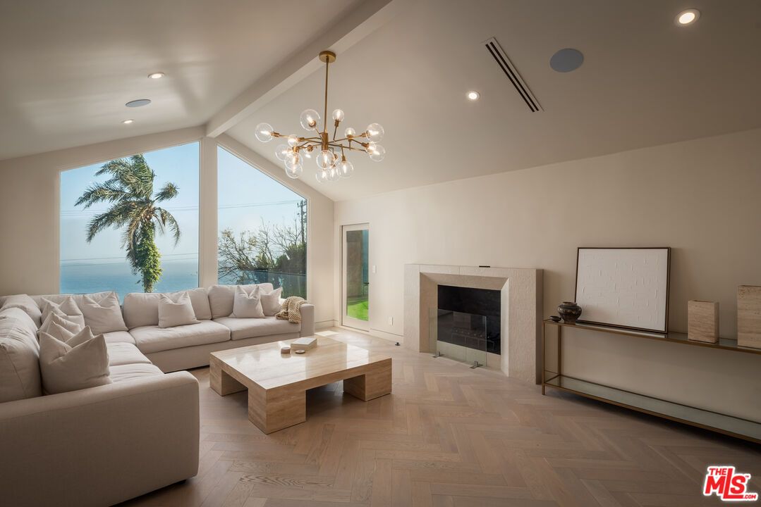 Fireplace, Interior, Living room, Pendant Lights, Recessed Lighting, Water, Wood Texture Flooring