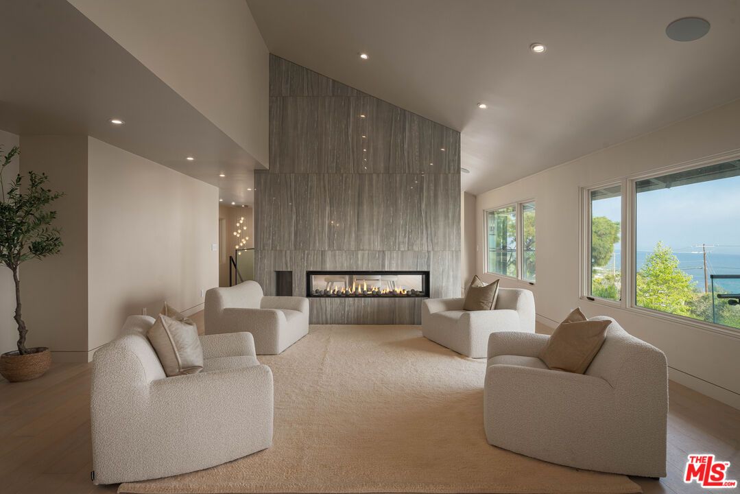 Fireplace, Interior, Living room, Recessed Lighting, Water, Wood Texture Flooring