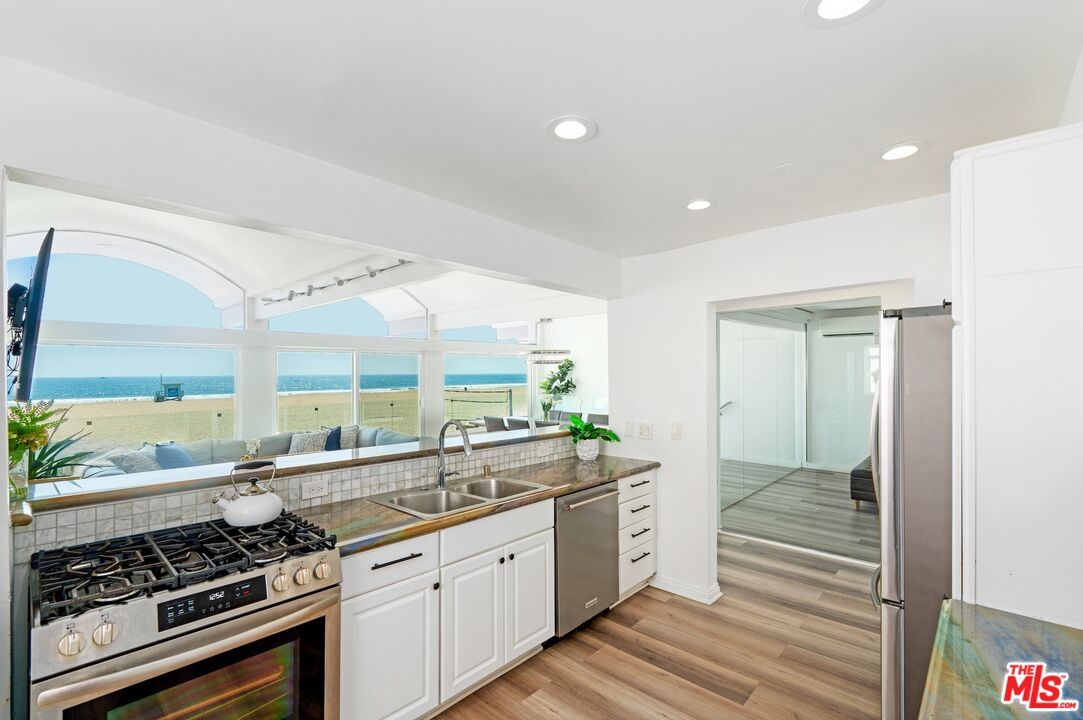 Interior, Kitchen, Recessed Lighting, Stainless Steel Appliances, Water, Wood Texture Flooring