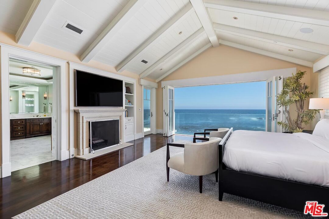 Bedroom, Fireplace, Interior, Recessed Lighting, Water, Wood Texture Flooring