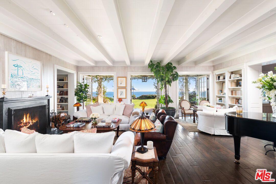 Fireplace, Interior, Living room, Piano, Recessed Lighting, Water, Wood Texture Flooring