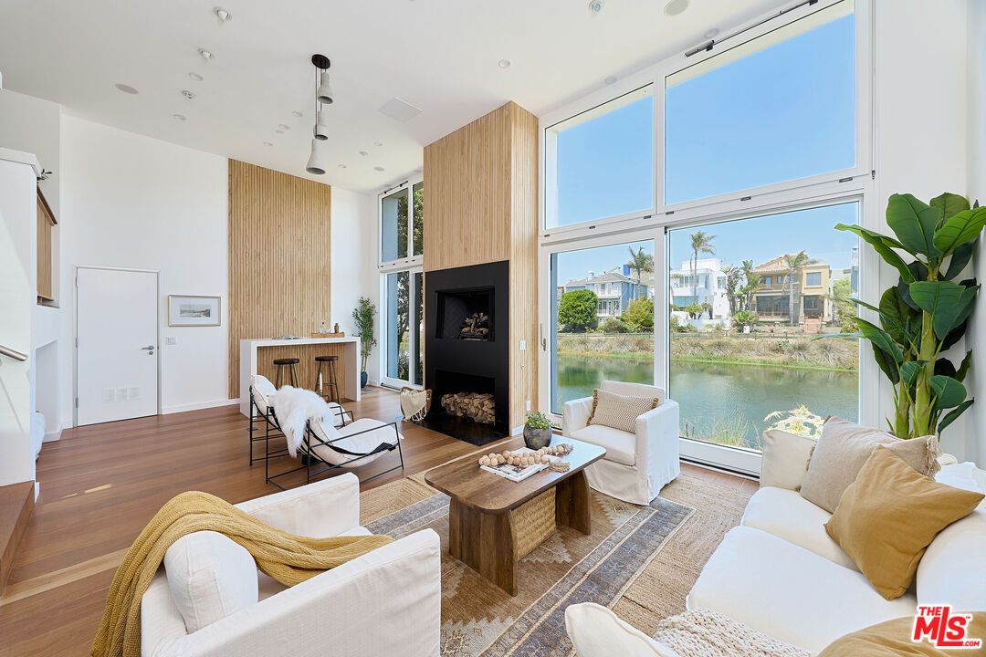 Fireplace, Interior, Living room, Recessed Lighting, Water, Wood Texture Flooring