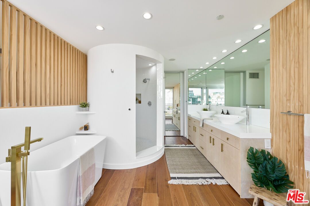 Bathroom, Dual Sink Vanities, Free Standing Baths, Glass Shower, Interior, Recessed Lighting, Wood Texture Flooring