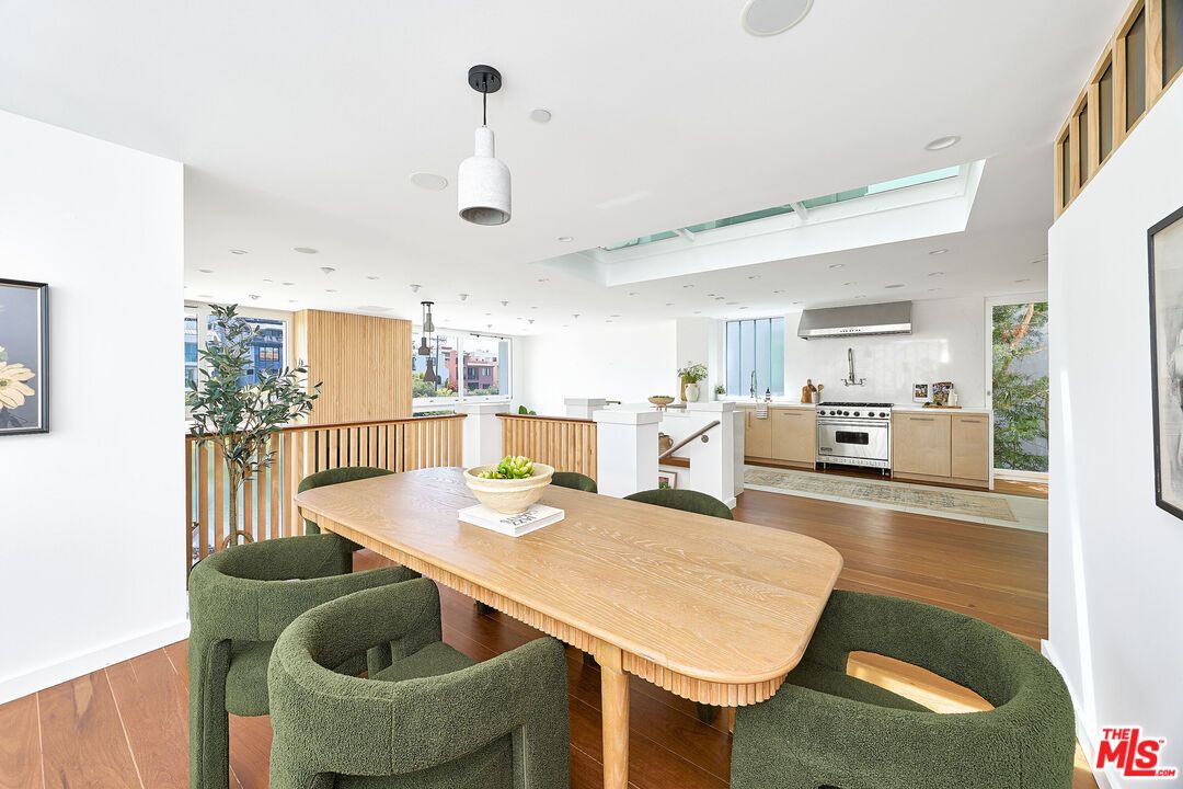 Dining room, Interior, Kitchen, Pendant Lights, Recessed Lighting, Stainless Steel Appliances, Wood Texture Flooring
