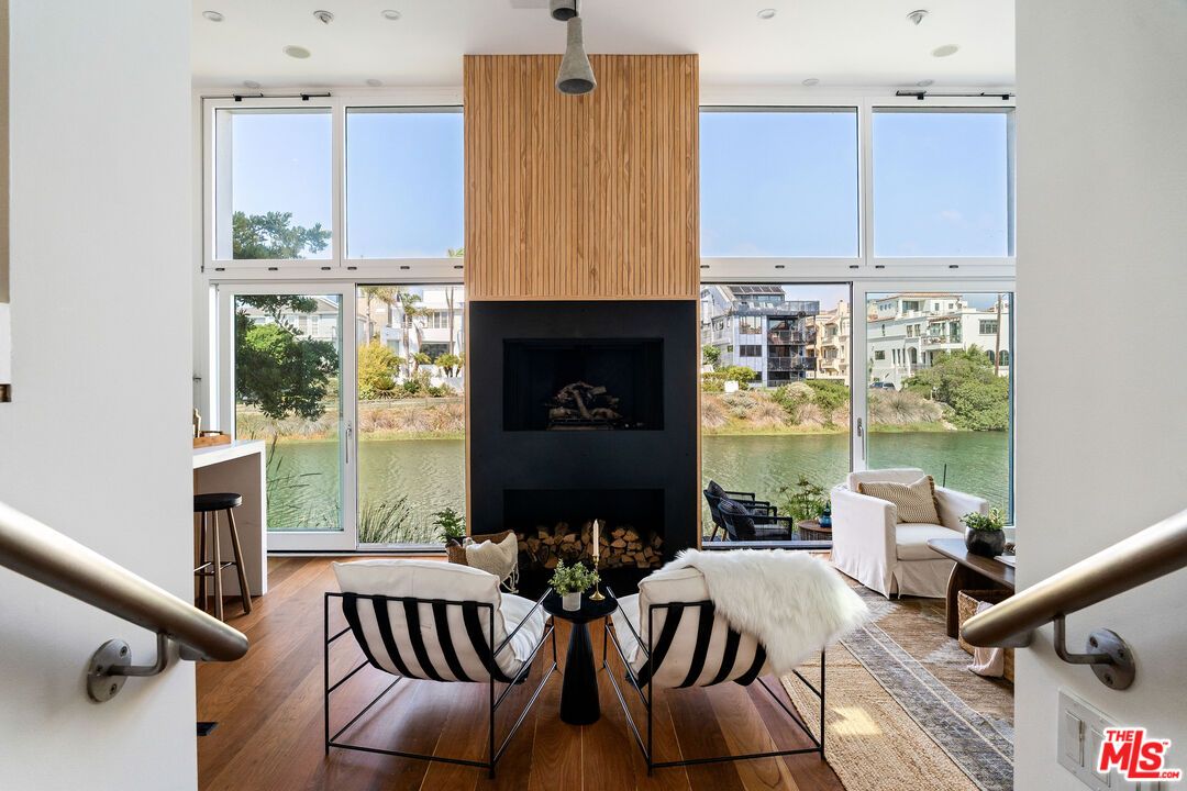 Fireplace, Interior, Living room, Recessed Lighting, Water, Wood Texture Flooring