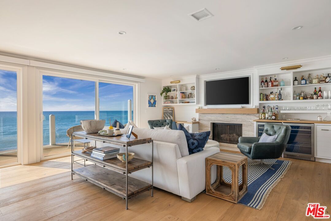 Fireplace, Interior, Living room, Recessed Lighting, Water, Wood Texture Flooring