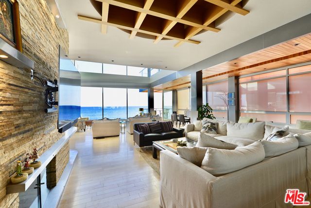 Fireplace, Interior, Living room, Recessed Lighting, Stone Walls, Water, Wooden Beams, Wooden Ceilings