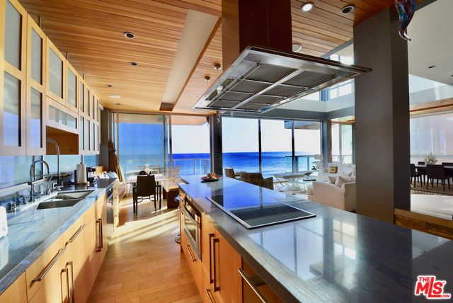 Dining room, Interior, Kitchen, Living room, Pendant Lights, Recessed Lighting, Stainless Steel Appliances, Water, Wooden Ceilings, Wood Texture Flooring