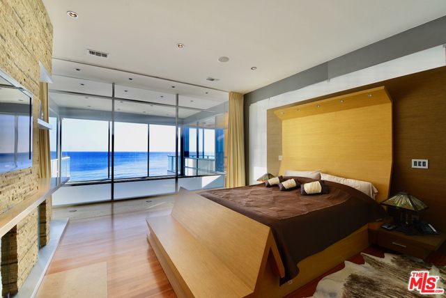 Bedroom, Fireplace, Interior, Recessed Lighting, Water, Wood Texture Flooring