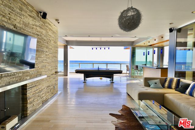 Billiard Table, Game Room, Interior, Living room, Pendant Lights, Recessed Lighting, Stone Walls, Water, Wood Texture Flooring