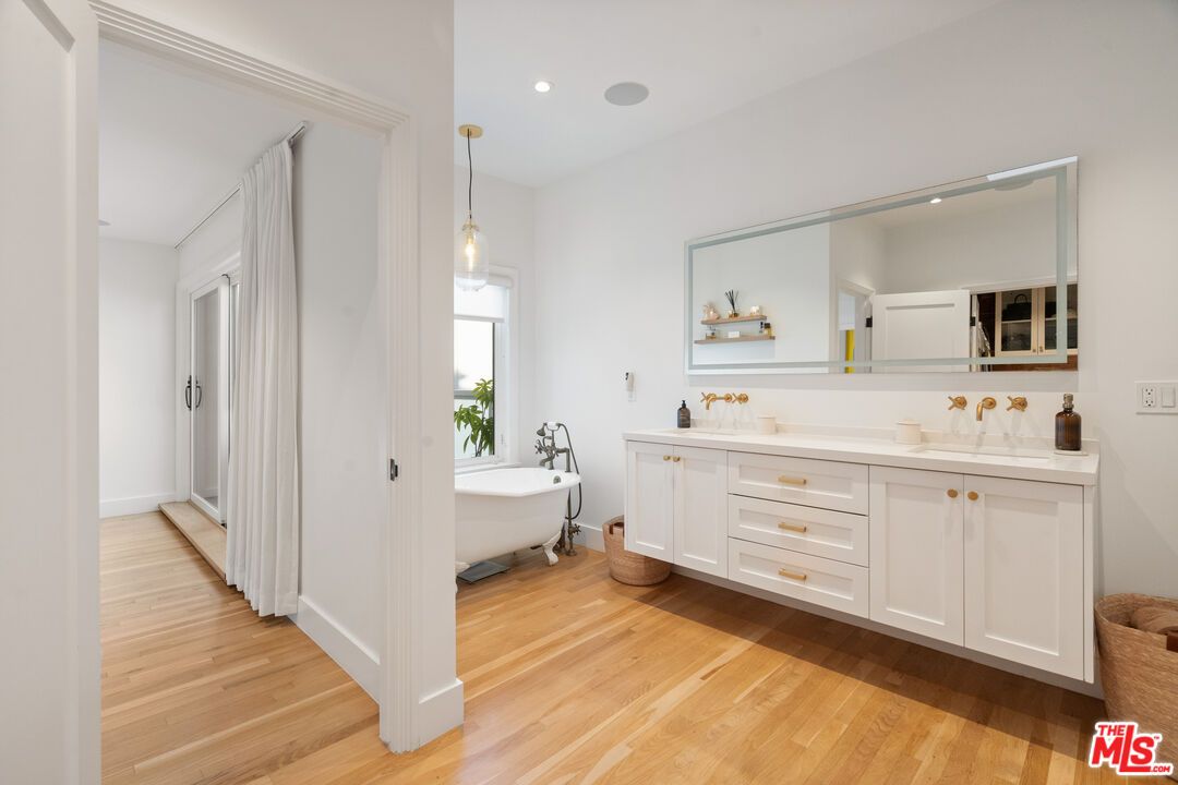 Bathroom, Dual Sink Vanities, Free Standing Baths, Interior, Pendant Lights, Recessed Lighting, Wood Texture Flooring