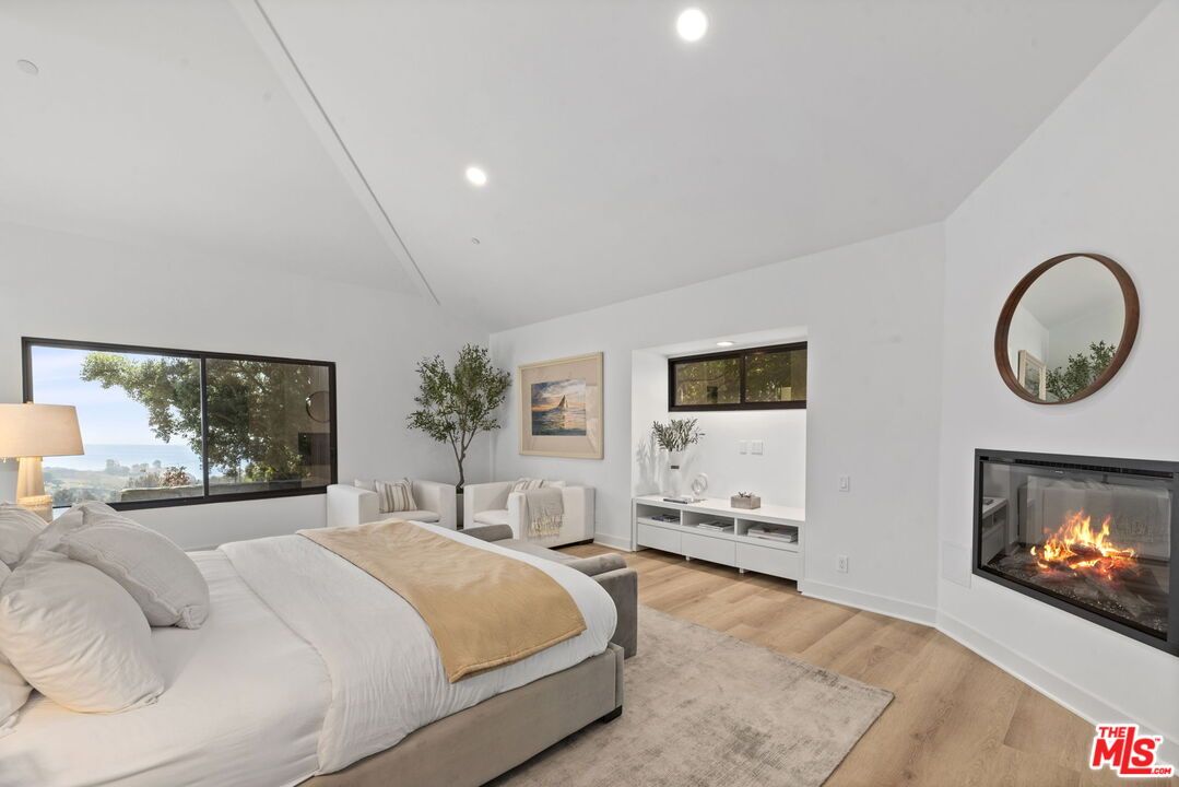 Bedroom, Fireplace, Interior, Recessed Lighting, Water, Wood Texture Flooring