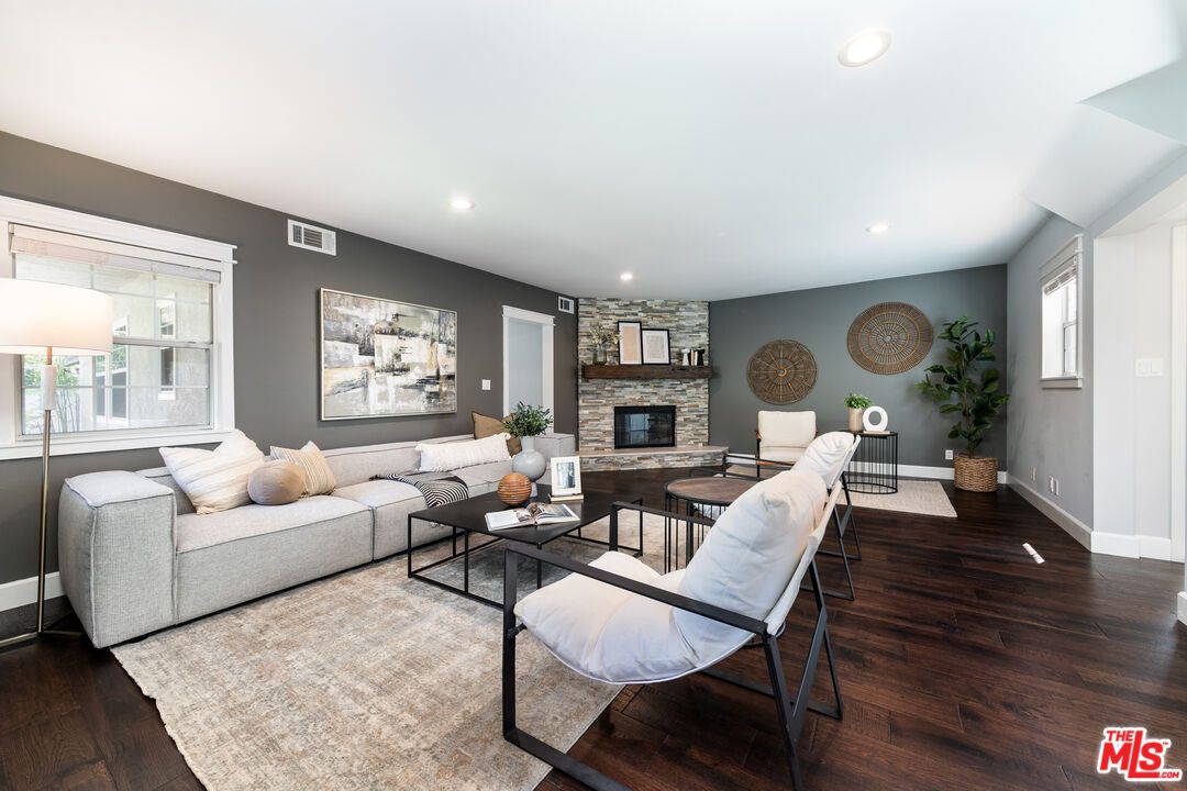 Fireplace, Interior, Living room, Recessed Lighting, Stone Walls, Wood Texture Flooring