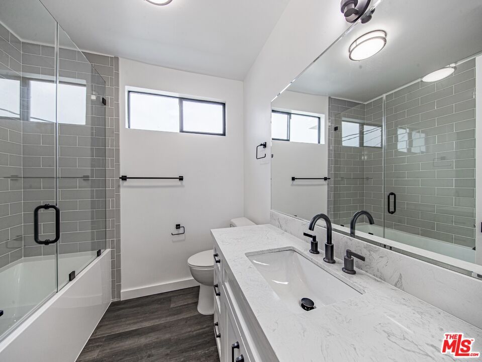 Bathroom, Dual Sink Vanities, Glass Shower, Interior, Wood Texture Flooring