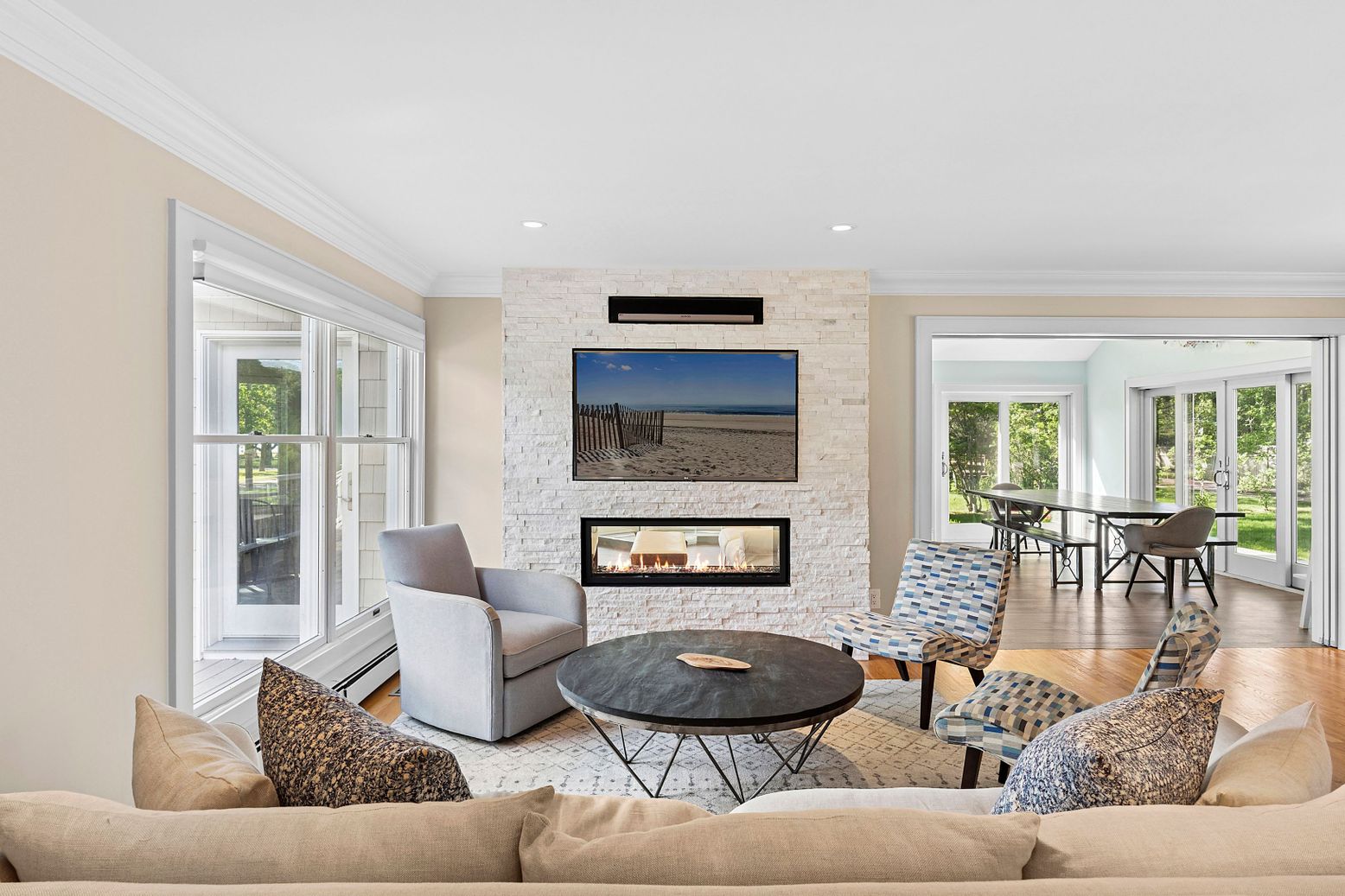Dining room, Fireplace, Interior, Living room, Recessed Lighting, Stone Walls, Wood Texture Flooring