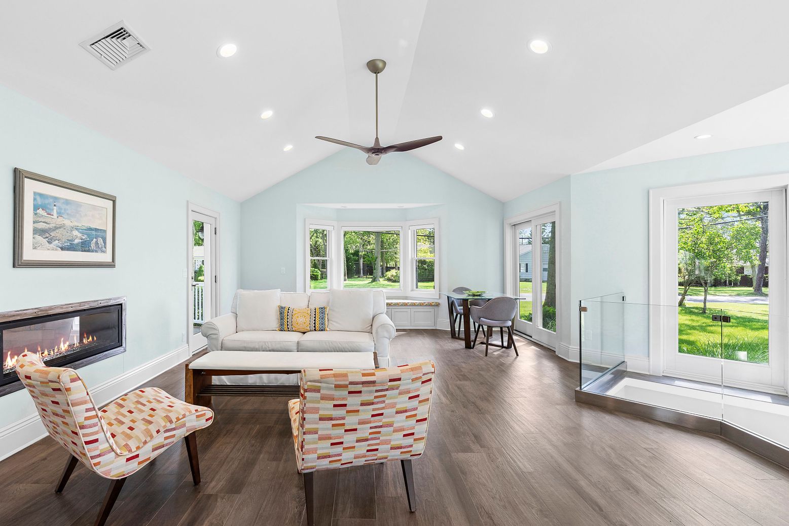 Dining room, Fireplace, Interior, Living room, Pendant Lights, Recessed Lighting, Wood Texture Flooring