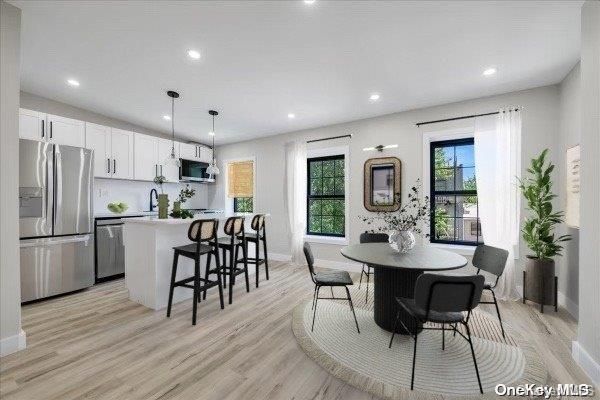 Dining room, Interior, Kitchen, Pendant Lights, Recessed Lighting, Stainless Steel Appliances, Wood Texture Flooring