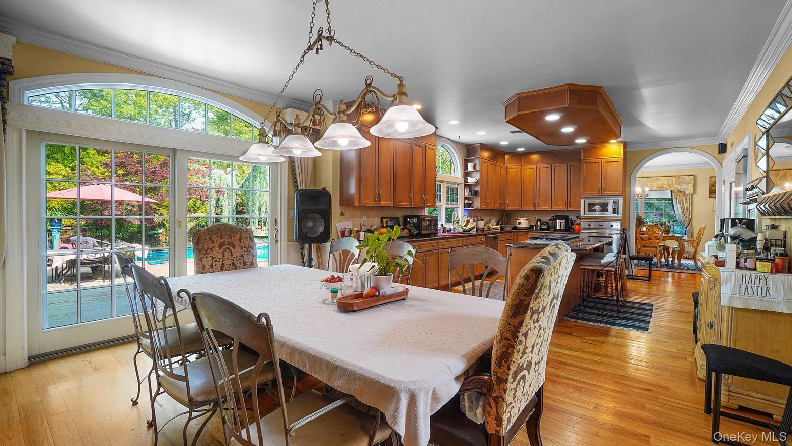Chandelier, Dining room, Interior, Kitchen, Pendant Lights, Recessed Lighting, Stainless Steel Appliances, Wood Texture Flooring