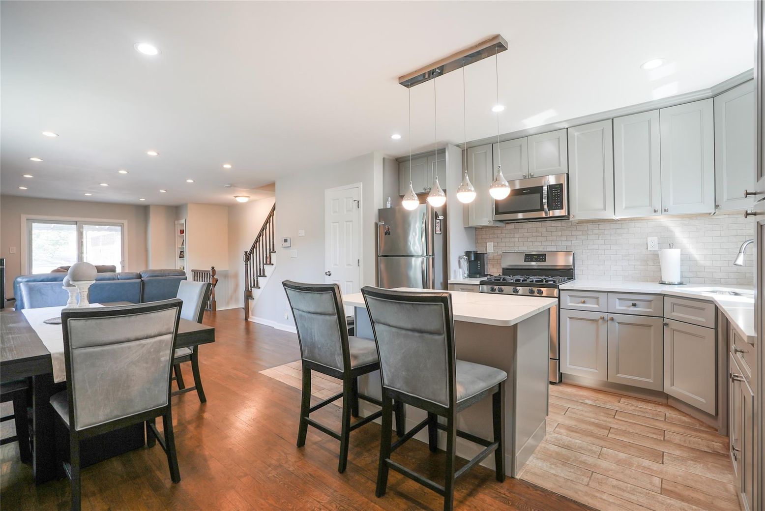 Dining room, Interior, Kitchen, Living room, Pendant Lights, Recessed Lighting, Stainless Steel Appliances, Wood Texture Flooring