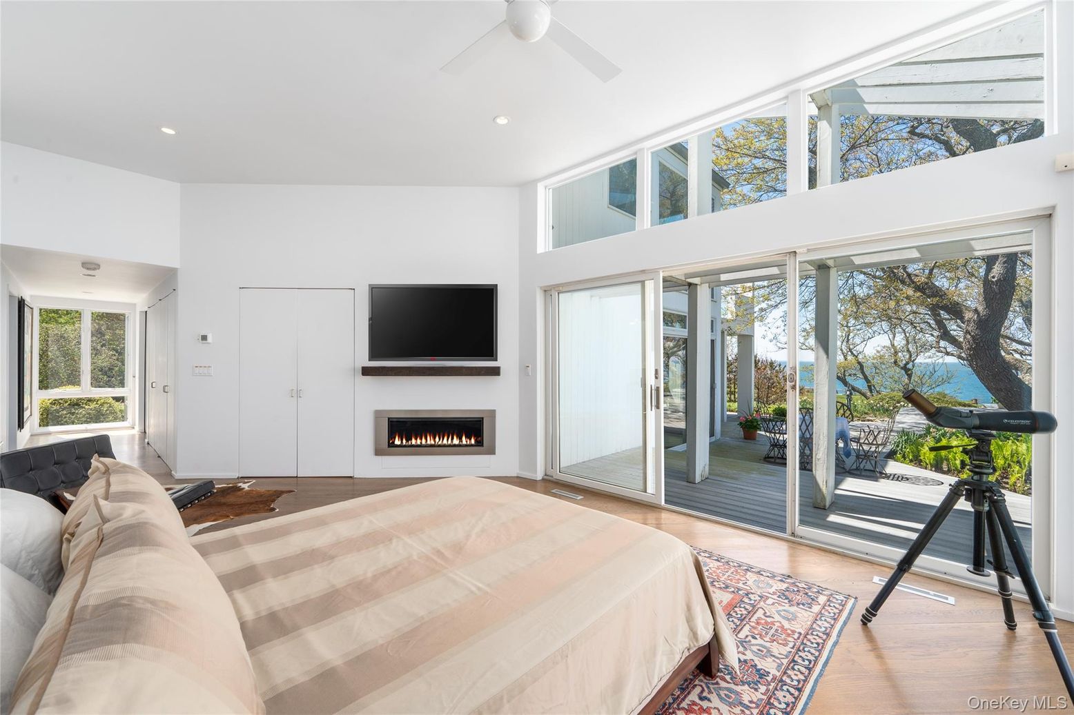 Bedroom, Fireplace, Interior, Recessed Lighting, Water, Wood Texture Flooring