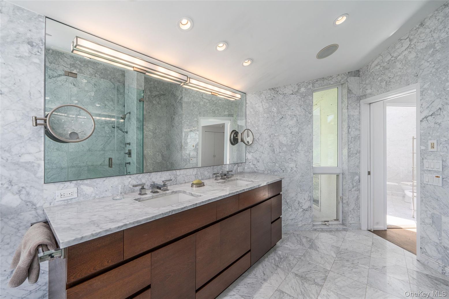 Bathroom, Dual Sink Vanities, Glass Shower, Interior, Marble, Marble Walls, Recessed Lighting