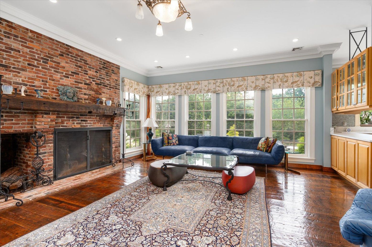 Fireplace, Interior, Living room, Recessed Lighting, Stone Walls, Wood Texture Flooring