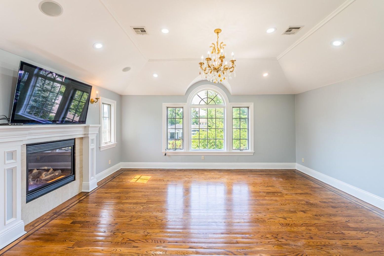 Chandelier, Empty room, Fireplace, Interior, Recessed Lighting, Wood Texture Flooring