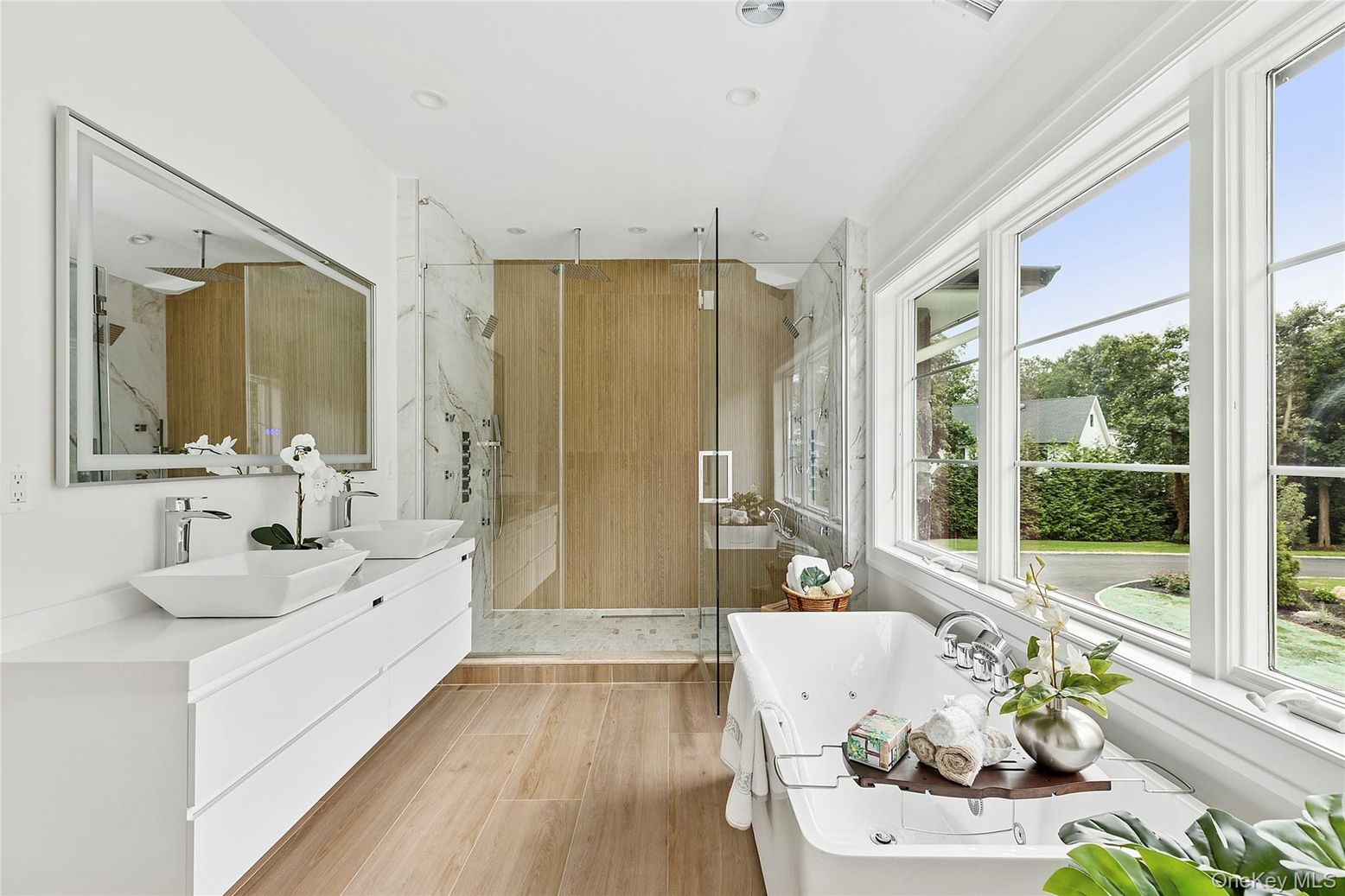 Bathroom, Free Standing Baths, Glass Shower, Interior, Marble Walls, Recessed Lighting, Wood Texture Flooring