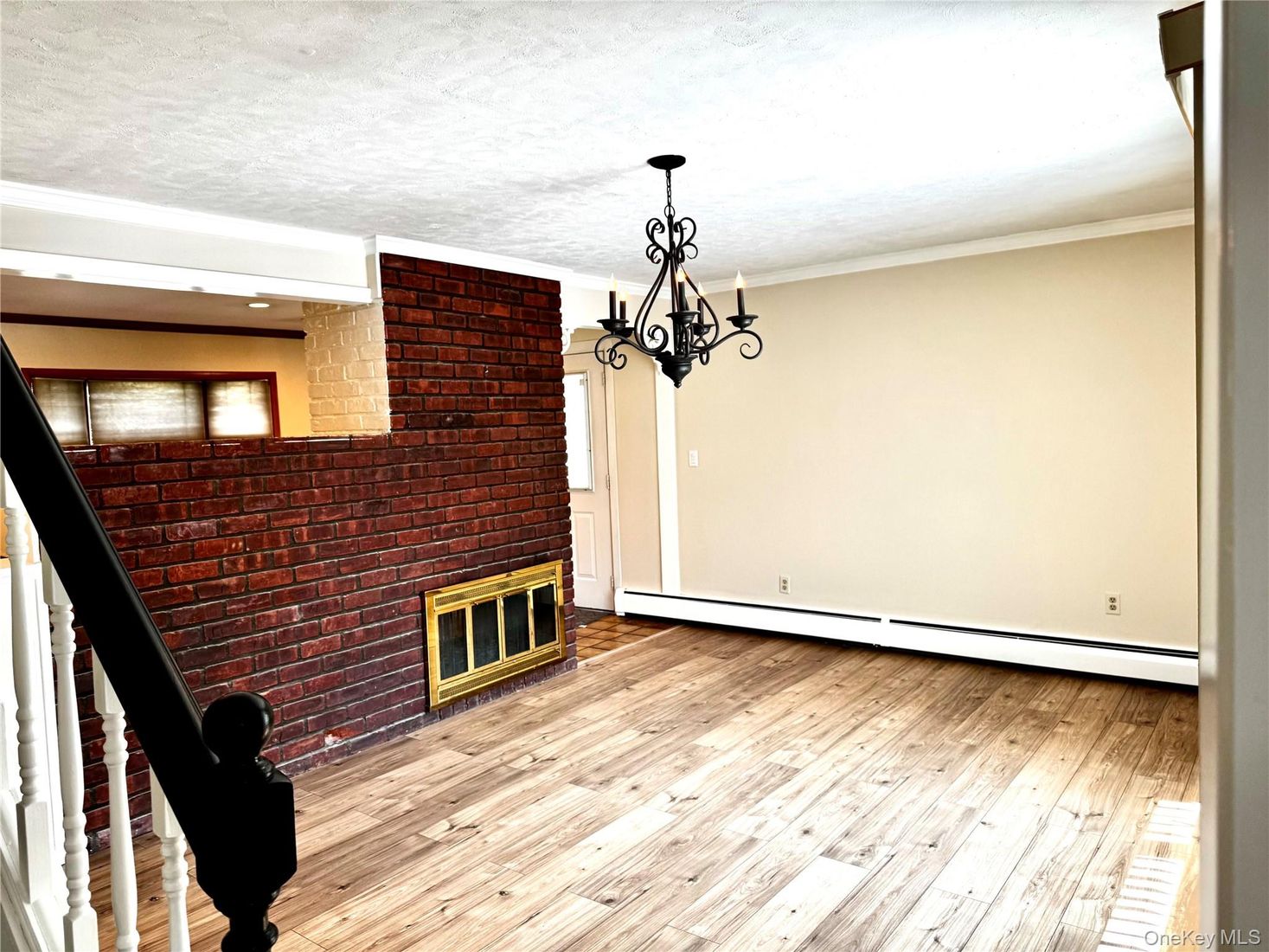 Chandelier, Empty room, Fireplace, Interior, Recessed Lighting, Stone Walls, Wood Texture Flooring