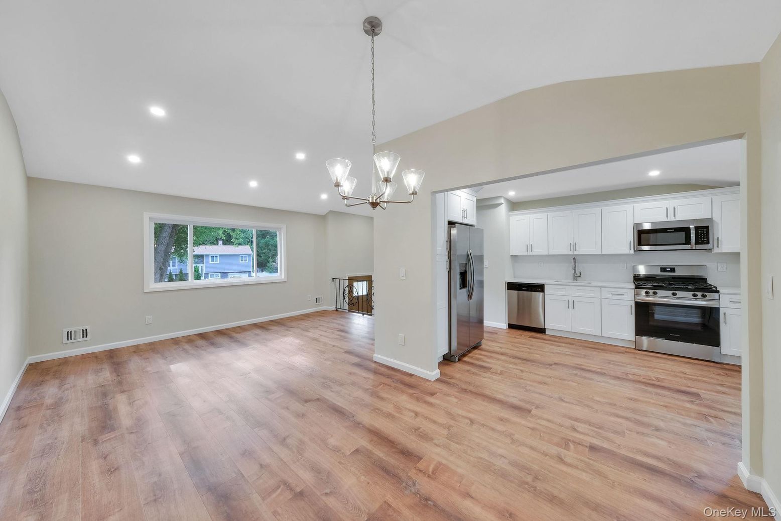 Chandelier, Empty room, Interior, Kitchen, Pendant Lights, Recessed Lighting, Stainless Steel Appliances, Wood Texture Flooring