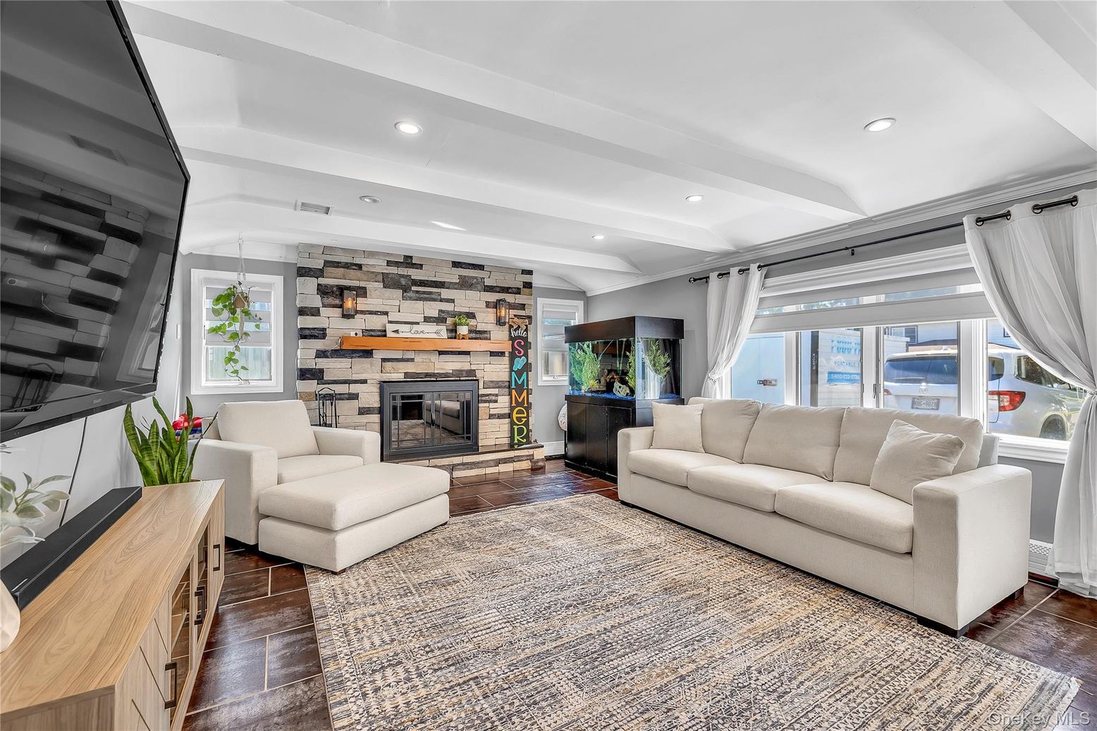 Fireplace, Interior, Living room, Recessed Lighting, Stone Walls, Wood Texture Flooring