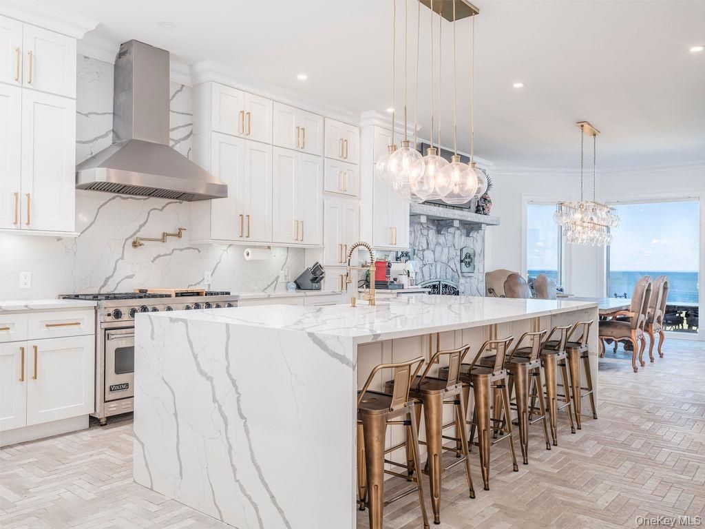 Chandelier, Interior, Kitchen, Marble Walls, Pendant Lights, Recessed Lighting, Stainless Steel Appliances, Water, Wood Texture Flooring