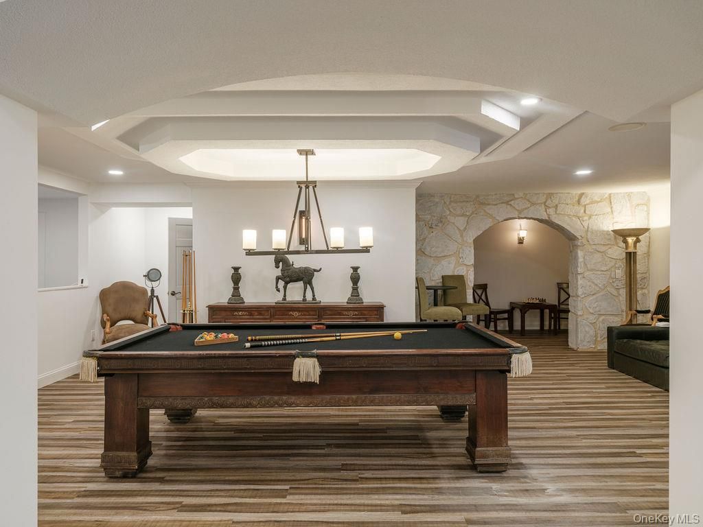 Billiard Table, Chandelier, Game Room, Interior, Pendant Lights, Recessed Lighting, Stone Walls, Wood Texture Flooring