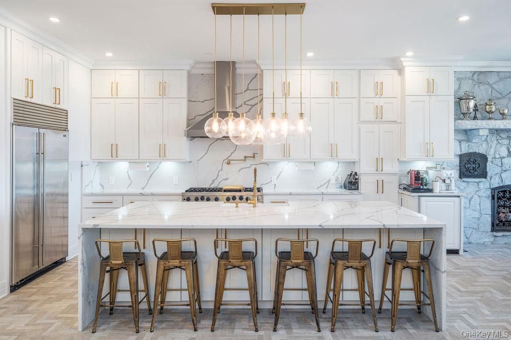 Interior, Kitchen, Marble Walls, Pendant Lights, Recessed Lighting, Stainless Steel Appliances, Wood Texture Flooring