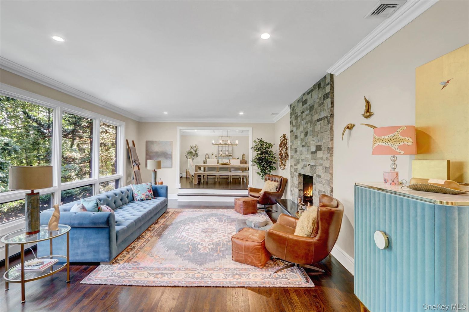 Dining room, Fireplace, Interior, Living room, Recessed Lighting, Stone Walls, Wood Texture Flooring