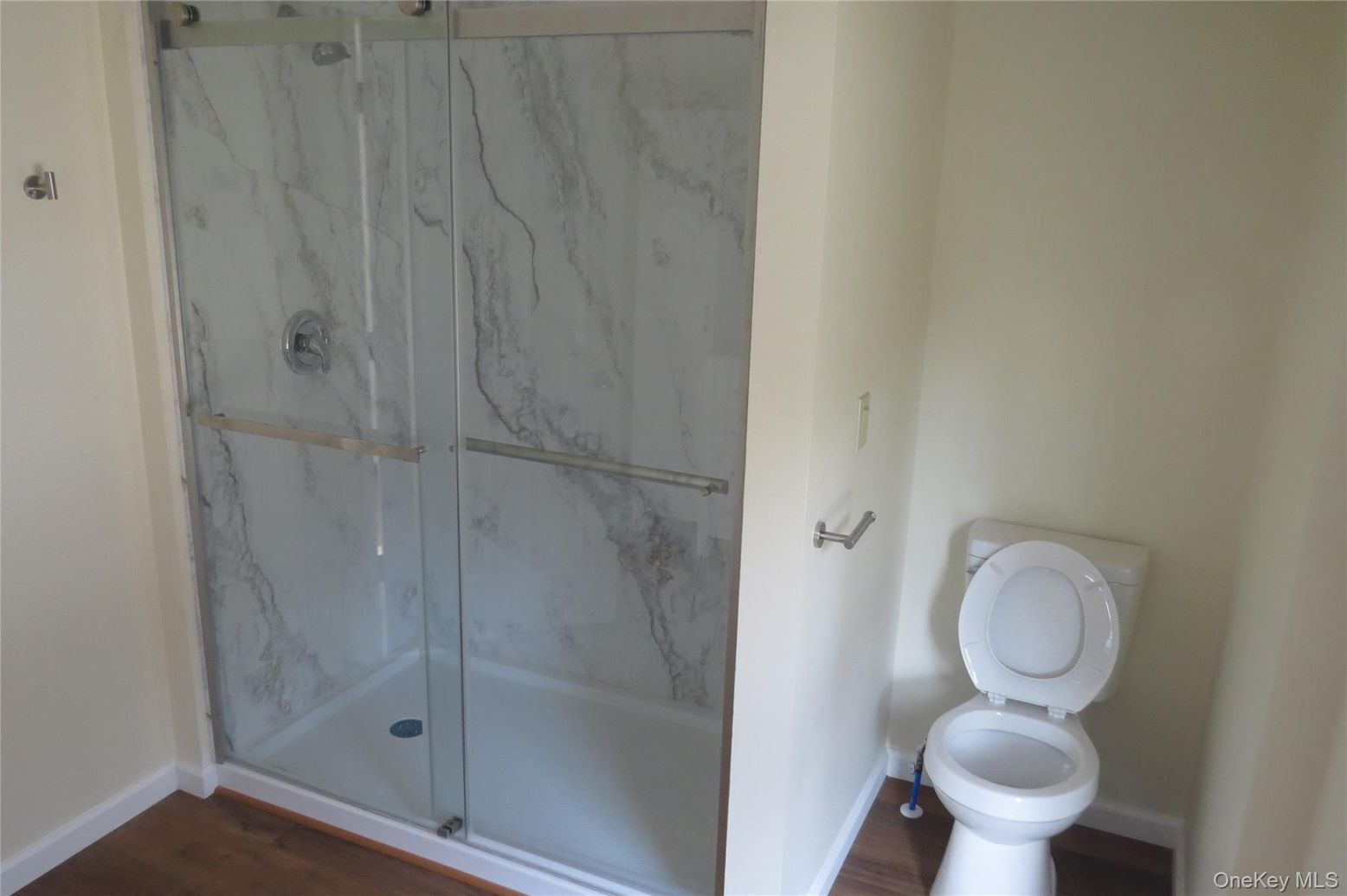 Bathroom, Glass Shower, Interior, Marble Walls, Wood Texture Flooring