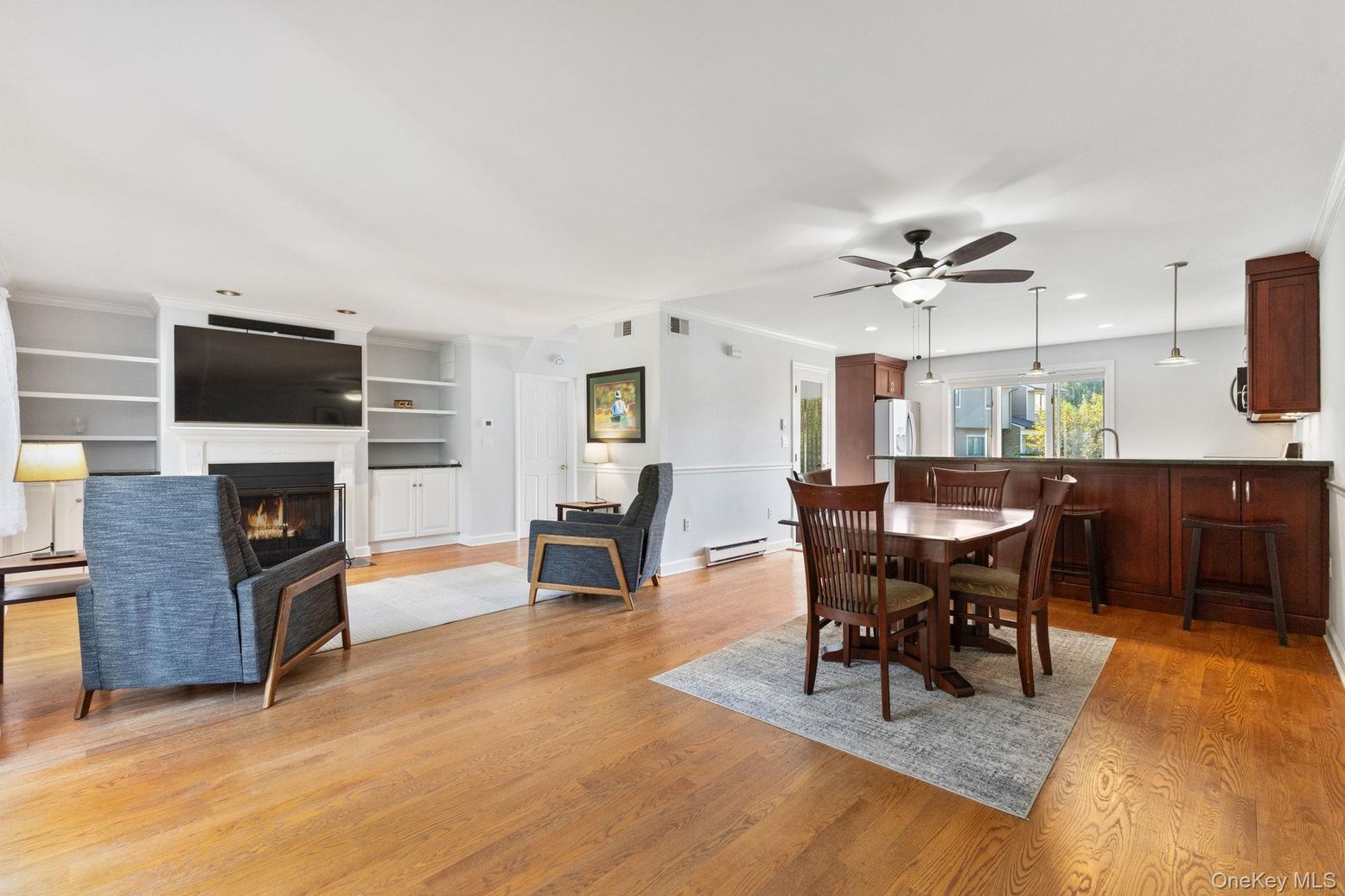 Dining room, Fireplace, Interior, Living room, Pendant Lights, Recessed Lighting, Wood Texture Flooring