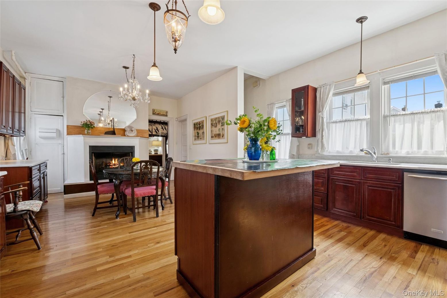 Chandelier, Dining room, Fireplace, Interior, Kitchen, Pendant Lights, Wood Texture Flooring