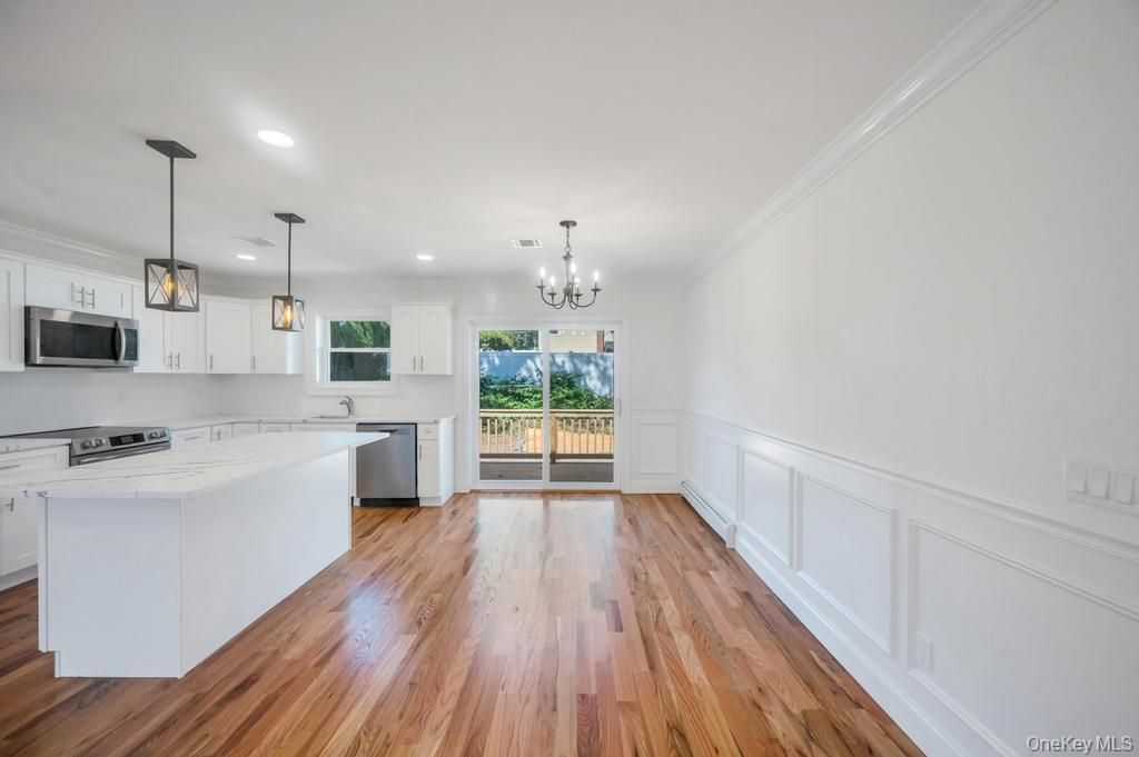 Chandelier, Interior, Kitchen, Pendant Lights, Recessed Lighting, Stainless Steel Appliances, Wood Texture Flooring