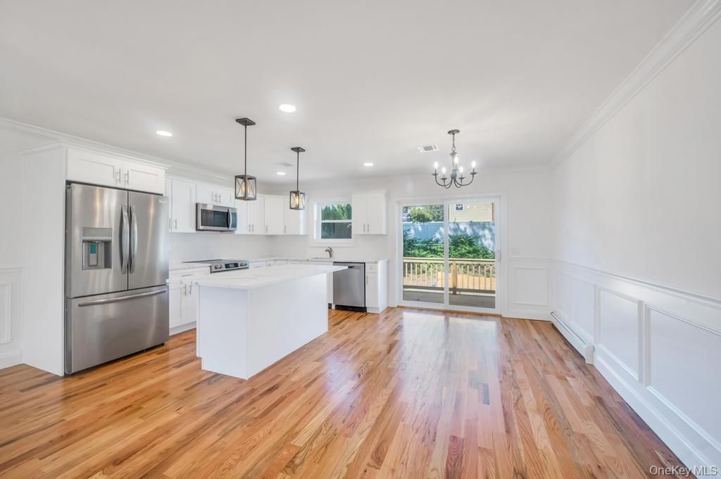 Chandelier, Interior, Kitchen, Pendant Lights, Recessed Lighting, Stainless Steel Appliances, Wood Texture Flooring