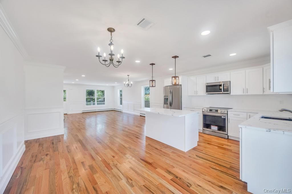 Chandelier, Interior, Kitchen, Pendant Lights, Recessed Lighting, Stainless Steel Appliances, Wood Texture Flooring