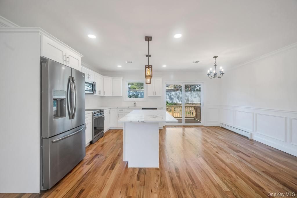 Chandelier, Interior, Kitchen, Pendant Lights, Recessed Lighting, Stainless Steel Appliances, Wood Texture Flooring