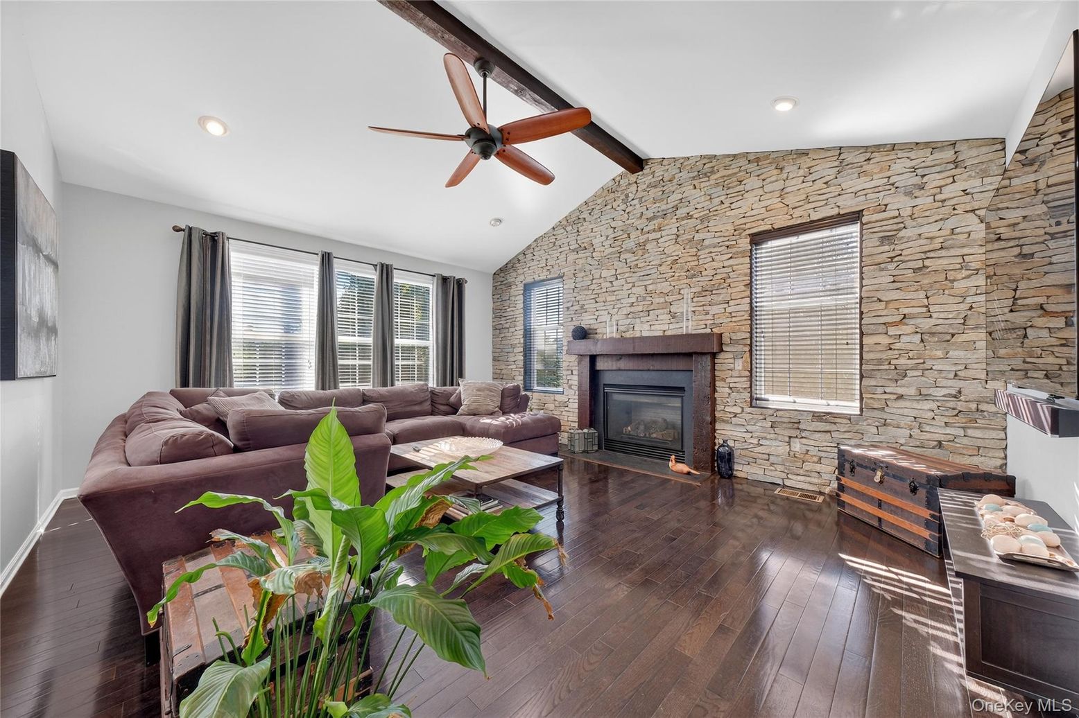 Fireplace, Interior, Living room, Recessed Lighting, Stone Walls, Wood Texture Flooring