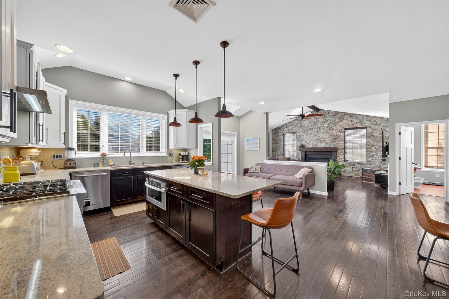 Fireplace, Interior, Kitchen, Living room, Pendant Lights, Recessed Lighting, Stainless Steel Appliances, Stone Walls, Wood Texture Flooring